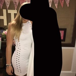 White dress with silver holes along the side